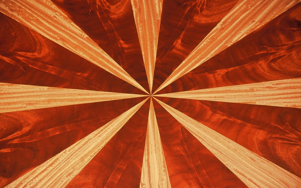 Detail; Round Coffee Table; sunburst pattern: mahogany wood, mahogany and satinwood veneer.