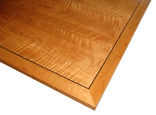 Dining Table Detail; modern; extendible: cherry wood, curly cherry veneer, ebony inlay.