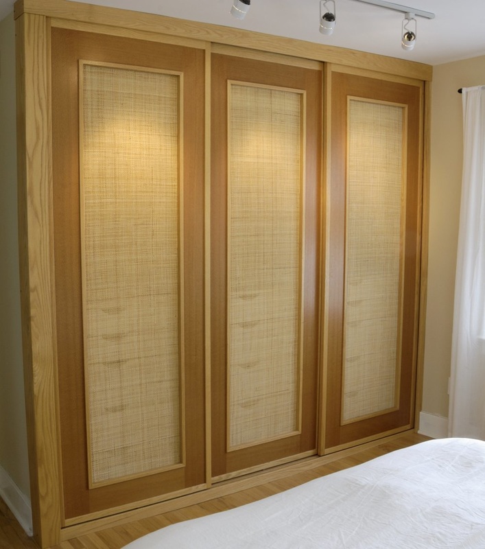 Sliding Closet Doors in red oak, Australian lacewood with woven cane panels.